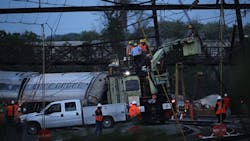 Repair crews inspect damages at the site of yesterdays Philadelphia derailment Repair crews inspect damages at the site of yesterdays Philadelphia derailment