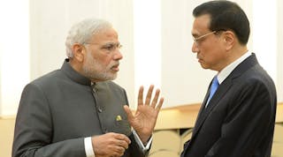 Indian Prime Minister Narendra Modi talks with Chinese Premier Li Keqiang after a press conference at the Great Hall of the People in Beijing, China. Modi is on a three-day state visit to China.
