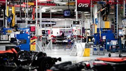 A factory floor full of newer manufacturing technology A factory floor full of newer manufacturing technology