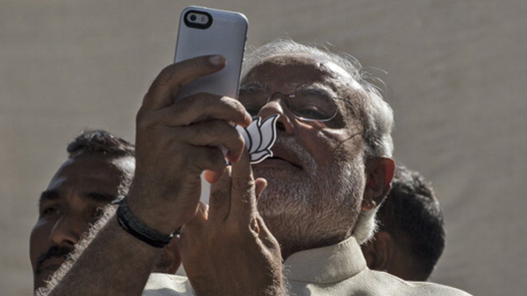 Indian prime minister Narenda Modi takes a photo with his phone