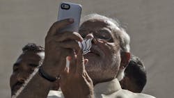Indian prime minister Narenda Modi takes a photo with his phone Indian prime minister Narenda Modi takes a photo with his phone