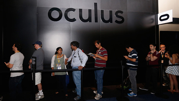 Attendees wait in line at the Oculus display