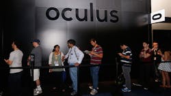 Attendees wait in line at the Oculus display Attendees wait in line at the Oculus display