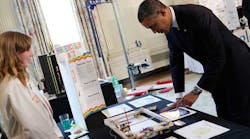 President Obama looks at a paint robot created by Sylvia Todd of Auburn, Calif., during the 2013 White House Science Fair. The annual event recognizes student achievements in science, technology, engineering and math competitions from across the U.S.