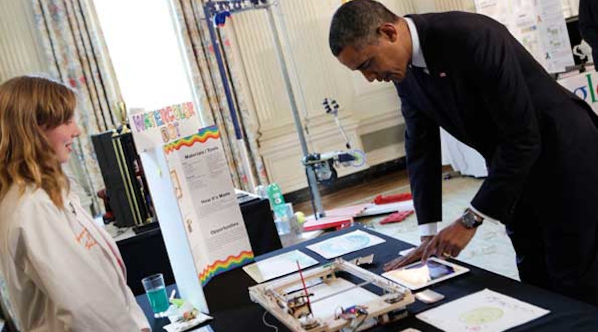 President Obama looks at a paint robot created by Sylvia Todd of Auburn, Calif., during the 2013 White House Science Fair. The annual event recognizes student achievements in science, technology, engineering and math competitions from across the U.S.