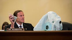 U.S. Senator Richard Blumenthal (D-Conn.) holds up an inflator and an airbag during a hearing in June.
