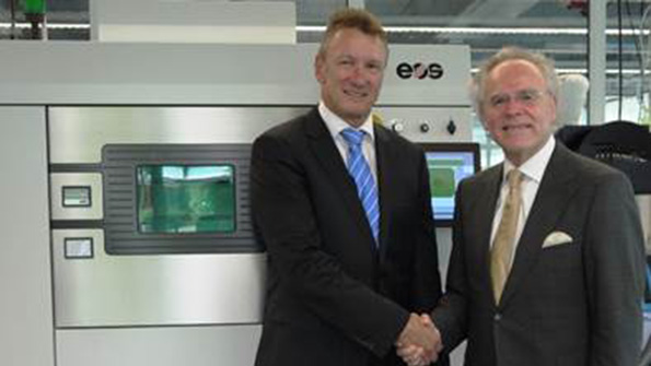 Pascal Boillat left the head of manufacturing solutions for GF poses with EOS founder and CEO Dr Hans Langer in front of an EOS M 290 metal additive manufacturing system