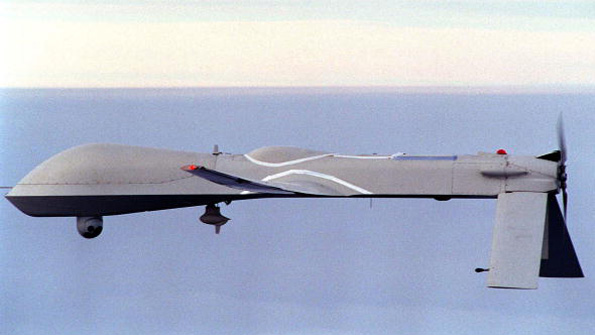 An unmanned Predator drone flies near the California coast