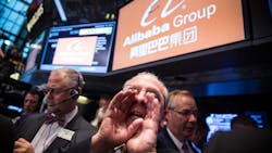 Traders at work on the day of Alibabas Wall Street IPO Traders at work on the day of Alibabas Wall Street IPO