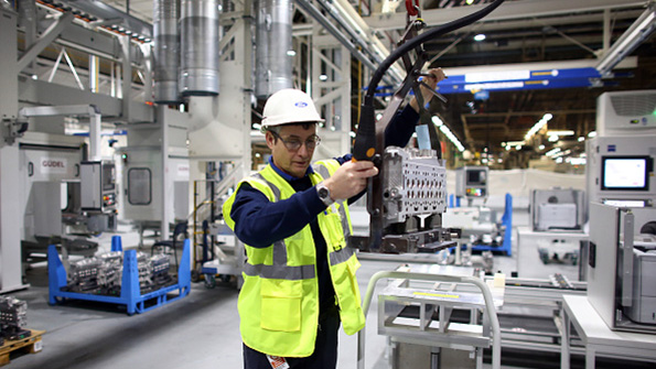 A plant employee at work