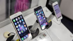 A trio of Apple iPhone 6s on sale in a retail location A trio of Apple iPhone 6s on sale in a retail location