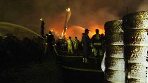 Firefighters spray water on a a blaze near Tokyo