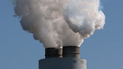 Emissions blow out of large coal power plant stack Emissions blow out of large coal power plant stack