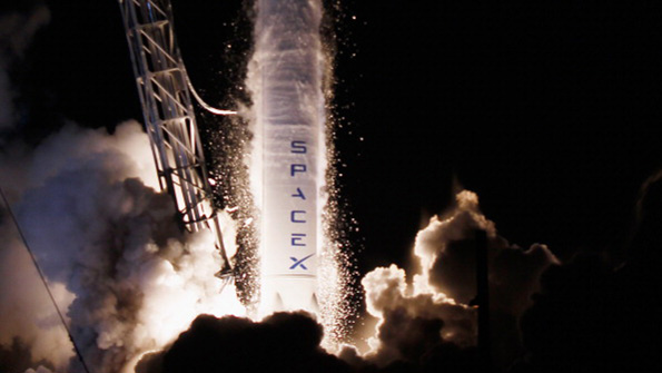 A SpaceX Falcon9 rocket attached to Dragon lifts off