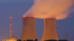 Steam rises from nuclear power plant cooling towers Steam rises from nuclear power plant cooling towers