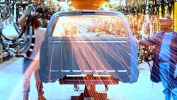 Two auto workers on the floor Two auto workers on the floor