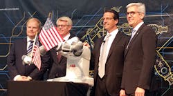 ABB CEO Ulrich Spiesshofer, far right, and other company executives introduce a new robotics factory in suburban Detroit in May. Spiesshofer announced Wednesday that the company will aim to save $1 billion.