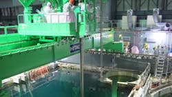 Workers remove nuclear fuel rods from a pool in Fukushima Workers remove nuclear fuel rods from a pool in Fukushima