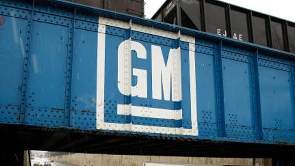GM logo painted on a train bridge