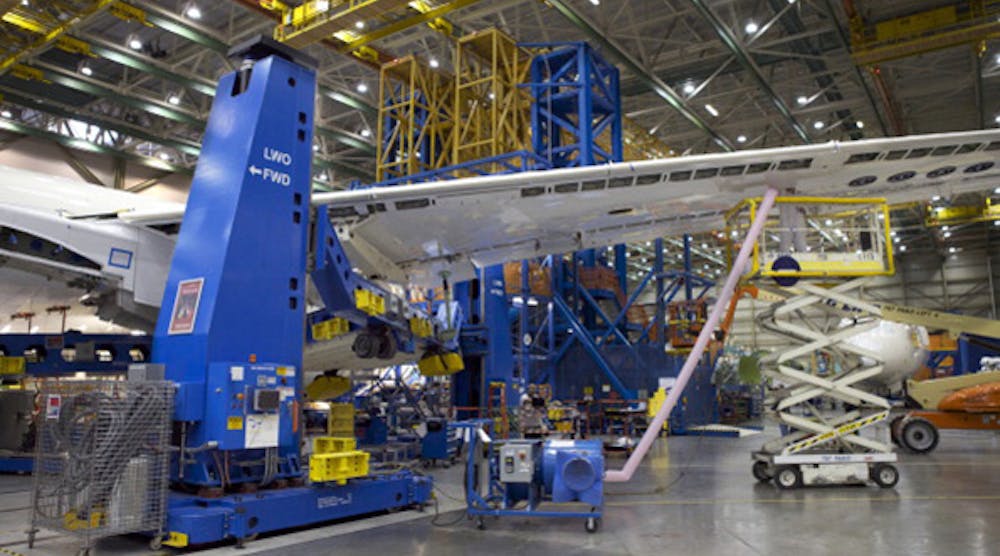 A Boeing employee works on the wing of a Boeing 787 Dreamliner at the Boeing Factory in Everett, Wash. The company has submitted plans for a new plant in China.