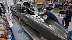 Engineers work on the carbon-fiber body of the Bloodhound SSC, which could shatter the global land speed record within the next two years.