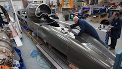 Engineers work on the carbonfiber body of the Bloodhound SSC Engineers work on the carbonfiber body of the Bloodhound SSC