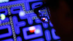 A video game player dives into PacMan A video game player dives into PacMan