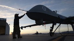 Maintenence personel check a Predator drone Maintenence personel check a Predator drone