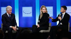 Theranos founder and CEO Elizabeth Holmes, center, talks with President Bill Clinton, left, and Alibaba Group executive chairman Jack Ma at the Clinton Global Initiative last month in New York. Holmes and Theranos are under fire after a potentially damaging Wall Street Journal report that alleges shaky science.