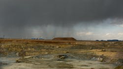 Trucks move ore at the Oyu Tolgoi mining area in the Gobi Desert in Mongolia Trucks move ore at the Oyu Tolgoi mining area in the Gobi Desert in Mongolia
