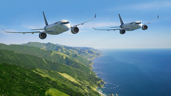 A pair of Bombardier C Series fly over islands and water in an artist rendition