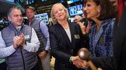 HP Enterprise CEO Meg Whitman, center, celebrates Monday after the company&apos;s stock is priced on the floor of the New York Stock Exchange.
