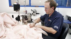 A Takata employee sews an airbag at the company&apos;s crash-testing facility in Auburn Hills, Michigan.