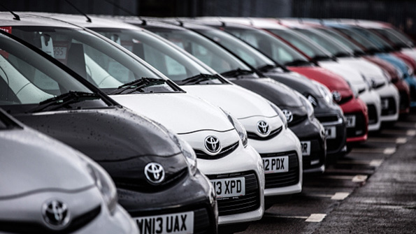 A line of Toyotas at a Bristol England lot