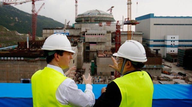 British and Chinese officials tour a new plant in Taishan. China will work with Argentina to help that country build a pair of nuclear power reactors.