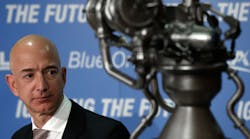 Blue Origin founder Jeff Bezos discusses the BE-4 rocket engine at a September news conference. The company made some waves by landing the first reusable rocket, though SpaceX boss Elon Musk clarified what it meant.