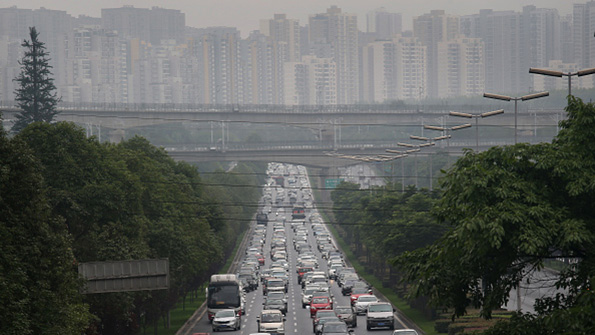 Commuter traffic and a smoggy sky in Chengdu China