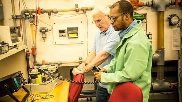 Joseph Dent right an apprentice in ArcelorMittal39s Steelworker for the Future program