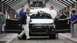 VW workers at a German plant VW workers at a German plant