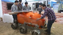 Technicians in Shanghai install a self-developed prototype airplane designed for probing Mars, at the China International Industry Fair.