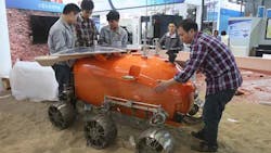 Technicians in Shanghai install a selfdeveloped prototype airplane designed for probing Mars at the China International Industry Fair Technicians in Shanghai install a selfdeveloped prototype airplane designed for probing Mars at the China International Industry Fair