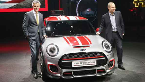 Peter Schwarzenbauer L member of the board of management at BMW AG and Jochen Goller senior vice president of MINI sales posed with the MINI John Cooper Works Concept car at the 2014 Detroit Auto Show