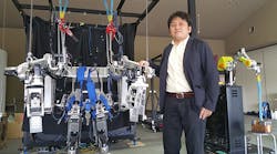 ActiveLink founder Hiromichi Fujimoto shows off his Power Effector power-assist suit at the company&apos;s offices in Nara, Japan. Fujimoto, who pitched the idea to his employer, Panasonic, in 2003, has been at work on power-assist technology for more than a decade &mdash; and has been dreaming about it since childhood.