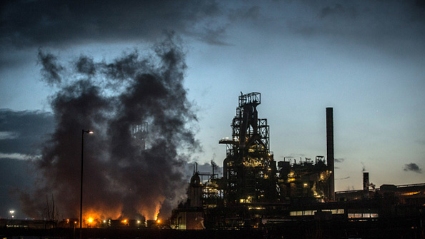 Blast furnace steam rises at a Welsh Tata plant