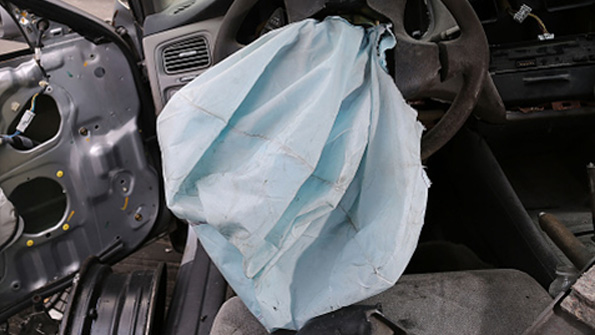 A deployed airbag inside a 2001 Honda Accord