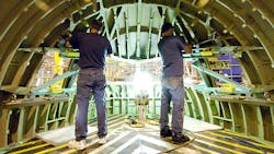 Boeing employees at work on a 777 cockpit Boeing employees at work on a 777 cockpit