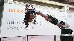 Hannover Messe attendees ride a roller coaster, of sorts, consisting entirely of a Kuka industrial robot and a pair of seats. The Chinese appliance maker Midea is angling to acquire as much as 30% of German-headquartered Kuka.