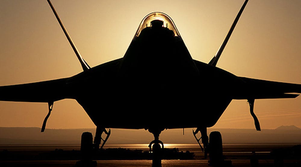 A Lockheed Martin F-22 Raptor 4001 stealth fighter, in silhouette.
