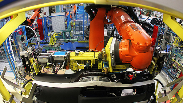 A Kuka robot installs a dashboard at the MercedesBenz factory in Sindelfingen