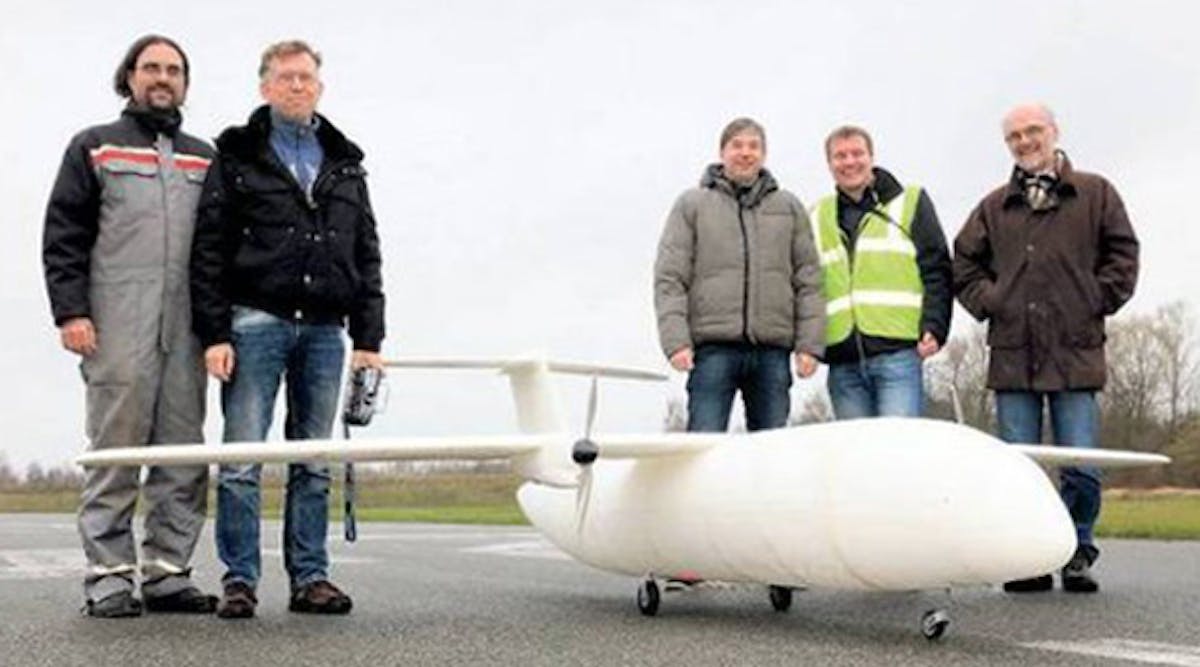 Members of the Airbus design team with Thor, the mini-plane constructed from 3D-printed parts (and short for &ldquo;Test of High-tech Objectives in Reality&rdquo;).